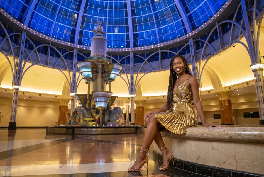 A woman at the fountain under the Fallsview glass dome