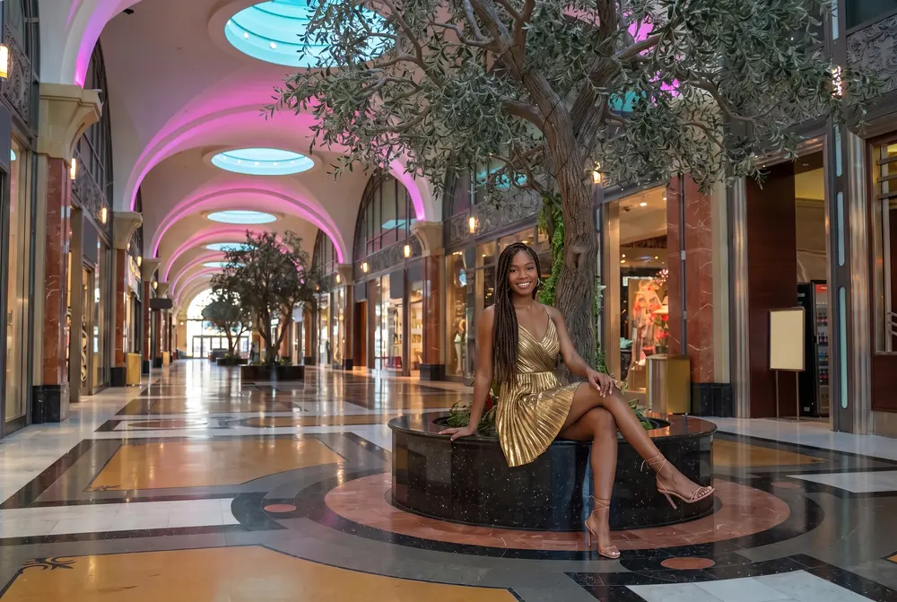 A woman by the olive tree in the Fallsview Galleria